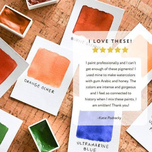 Color swatches with a five-star rating and positive review on a cork surface