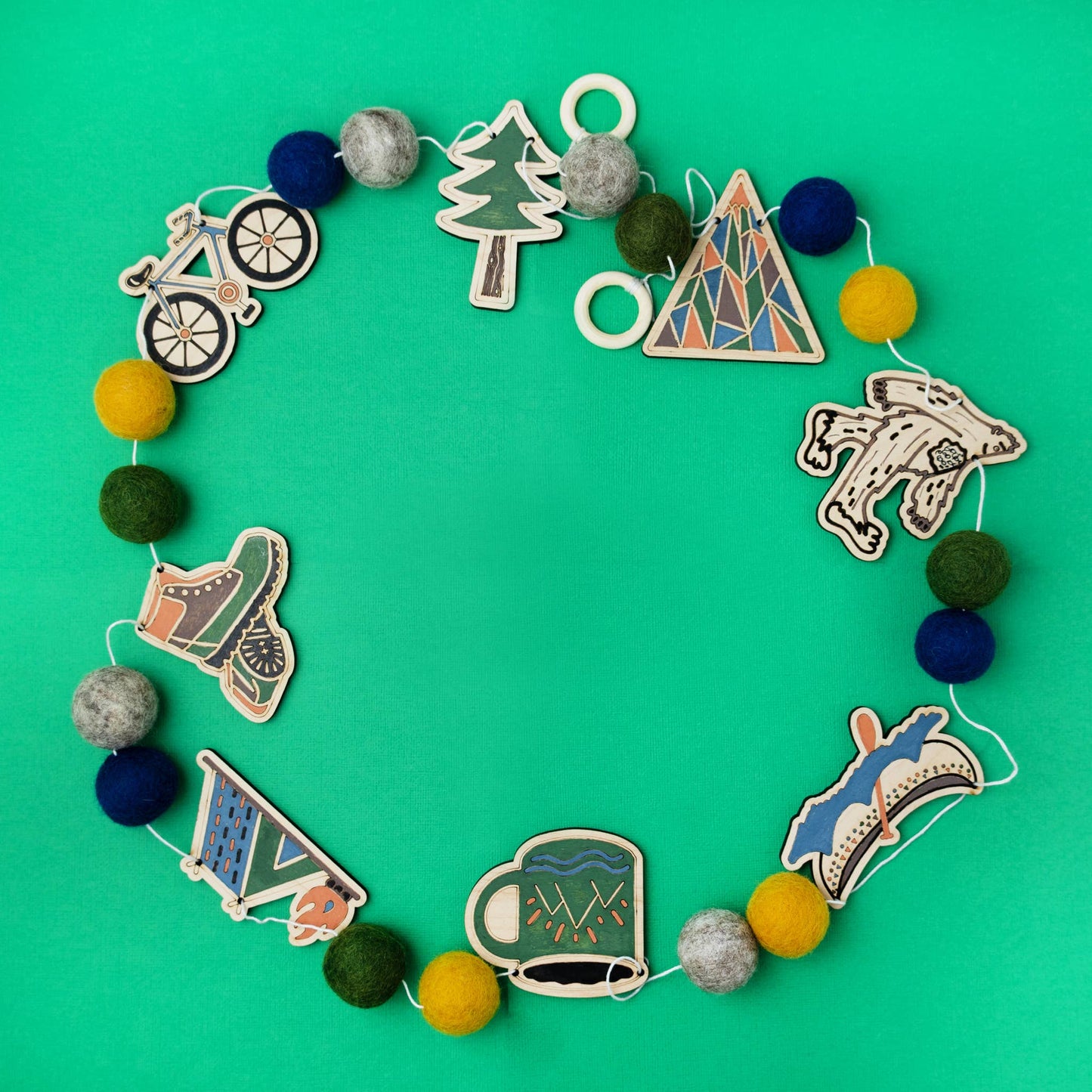 Decorative garland with various themed elements on a green background