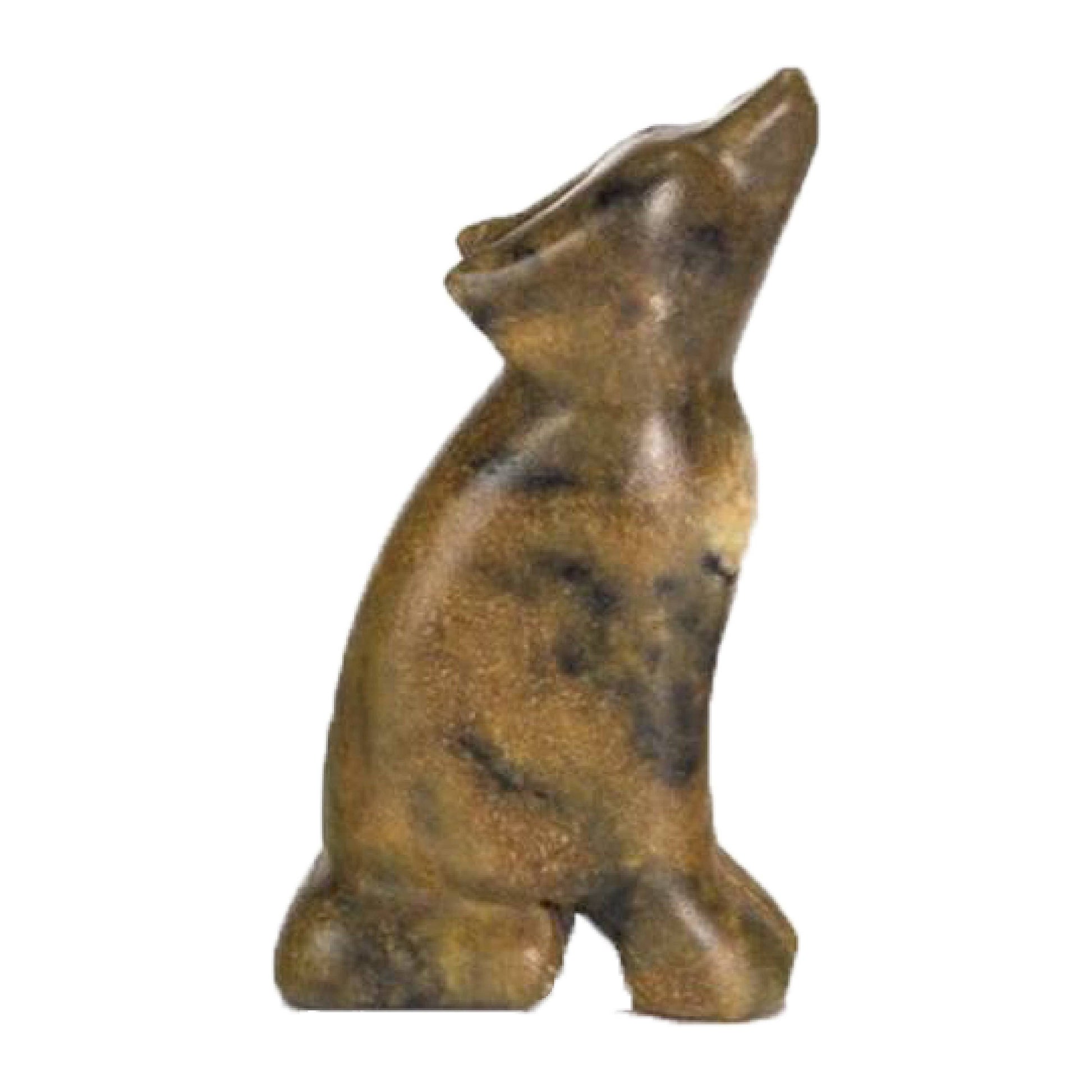 A finished soapstone wolf figurine on a white background.