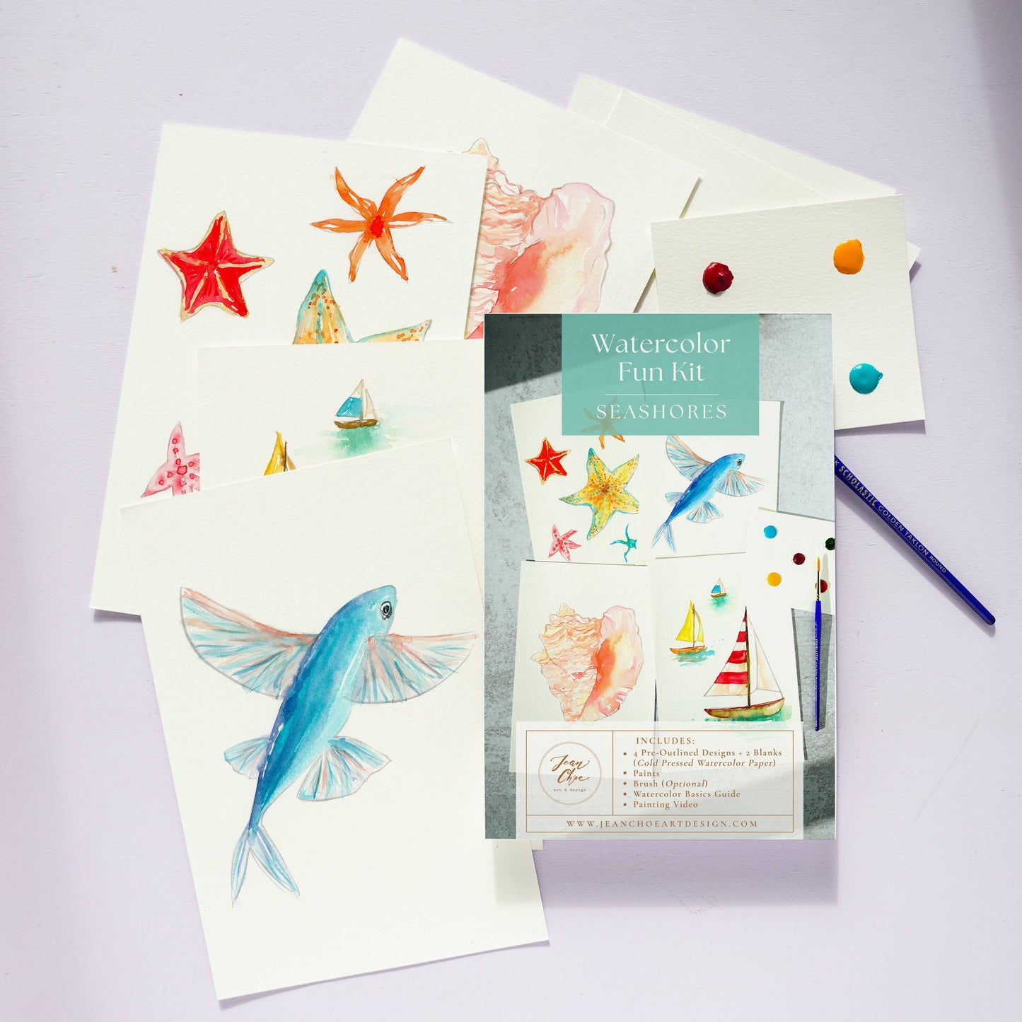 Watercolor Fun Kit with seashore-themed art supplies on a light purple background