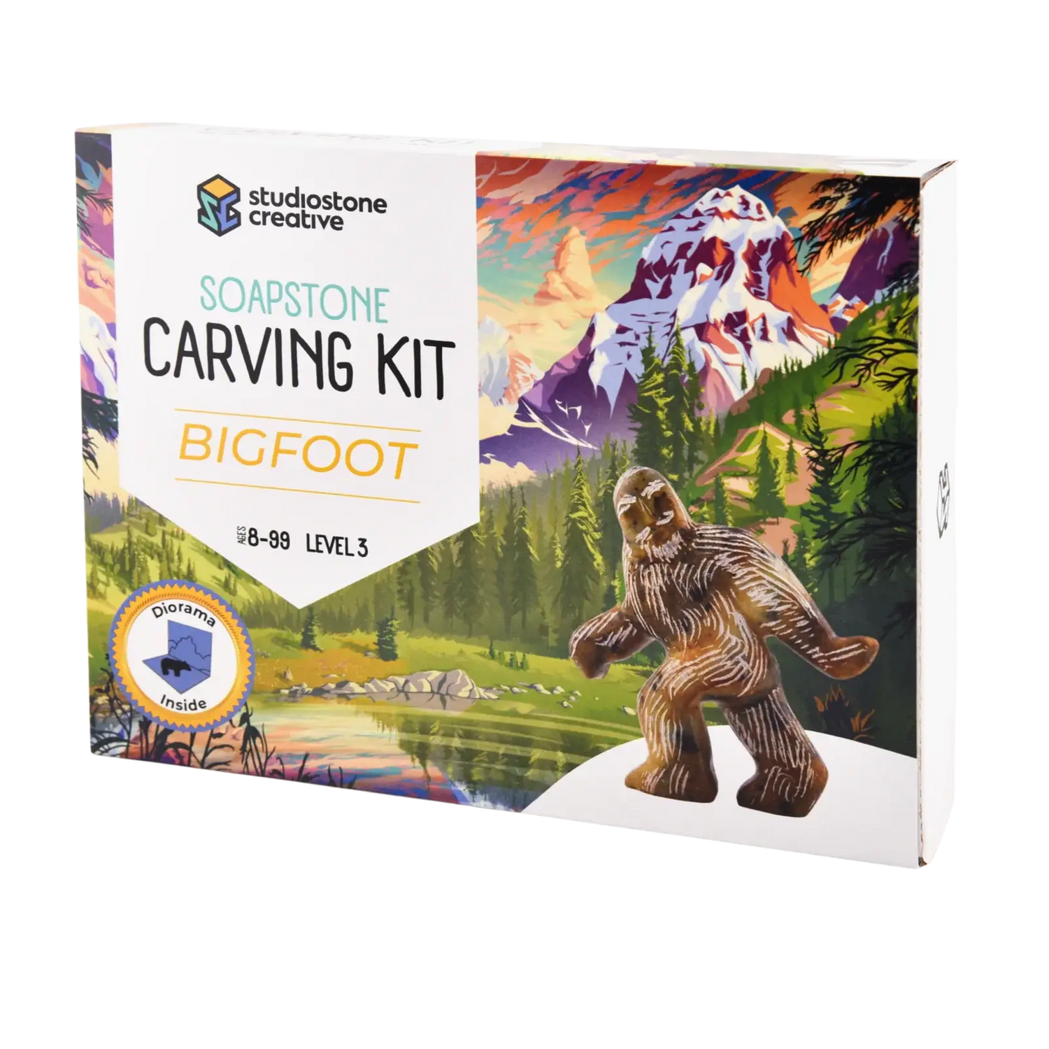 Soapstone carving kit packaging with a Bigfoot figure and mountain landscape illustration.