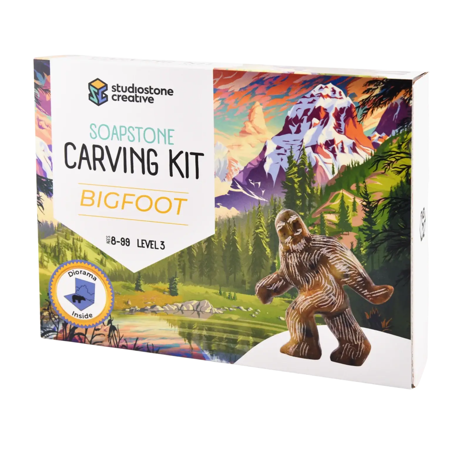 Soapstone carving kit packaging with a Bigfoot figure and mountain landscape illustration.