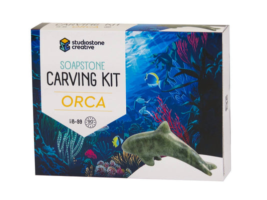 Soapstone carving kit packaging with the orca figure.