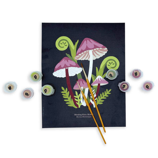 A paint by number finished painting of a group of mushrooms and leaves