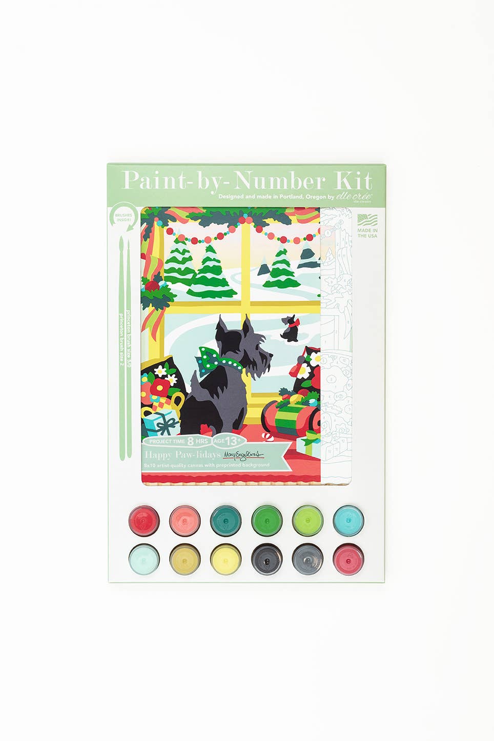 A Paint-by-Number Kit featuring a festive Christmas scene with a black Scottish terrier dog. The kit includes a printed illustration of the dog in a green bow, surrounded by holiday decorations, and a set of 12 numbered paint pots arranged below on a white background.