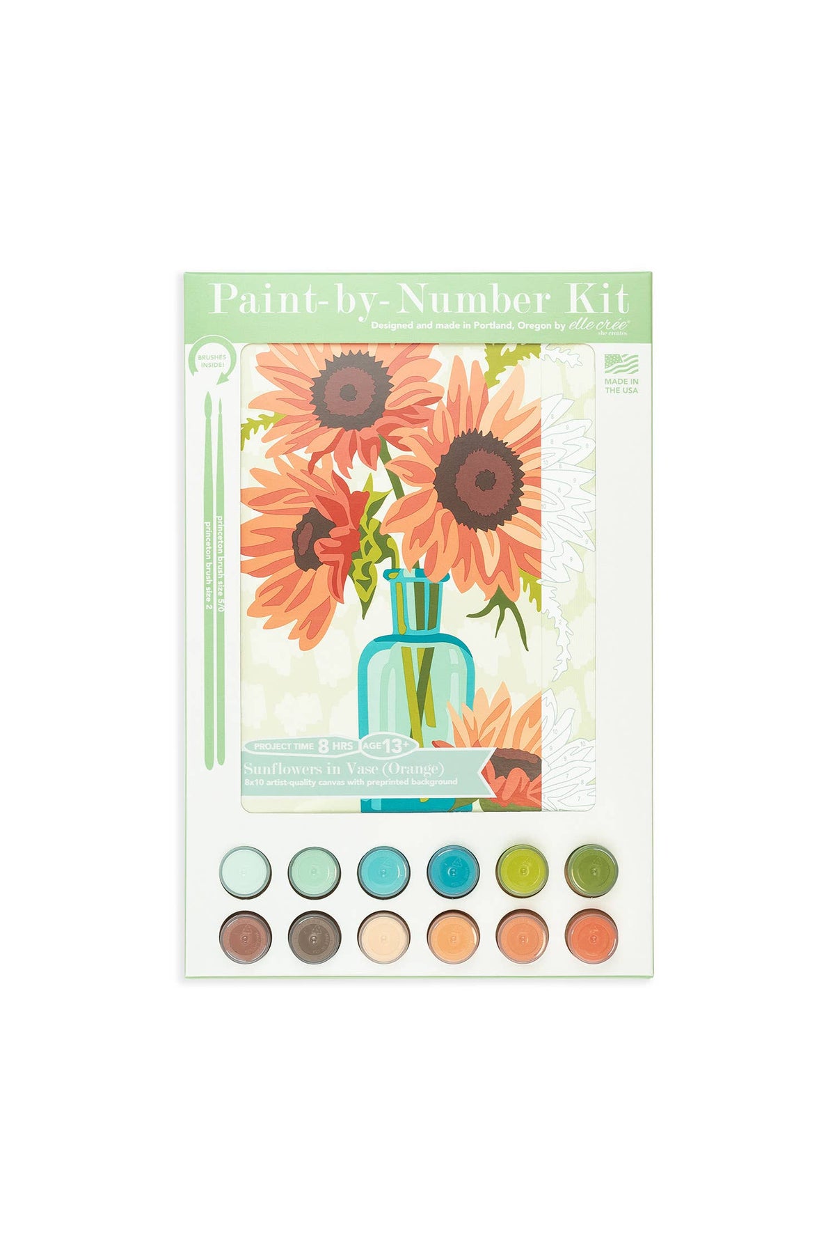 Paint-by-number kit packaging with flowers and color swatches on a white background