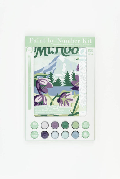 Paint-by-Number kit packaging featuring a design with Mt Hood in the background and and flowers in the foreground on a white background