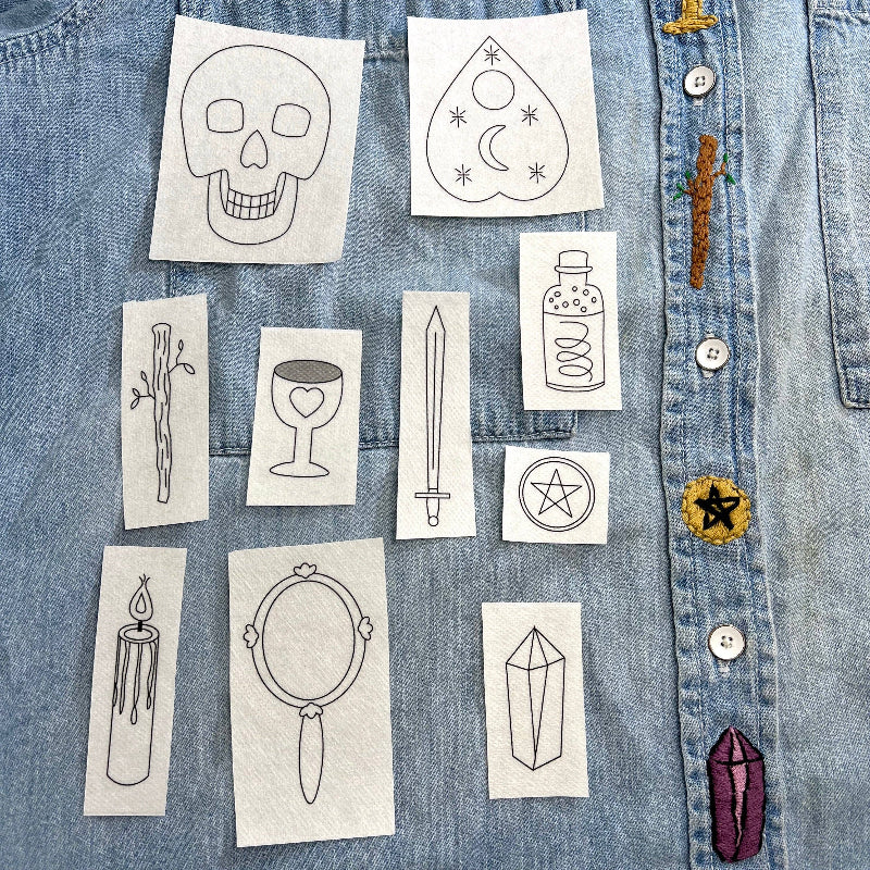 Set of stick on embroidery designs on a denim background