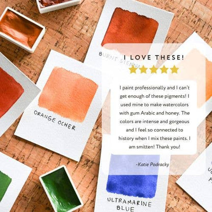Color swatches with a five-star rating and positive review on a cork surface