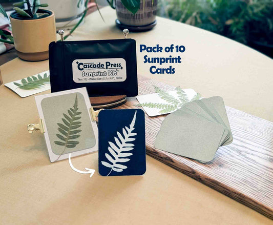 Pack of 10 Sunprint cards with a 'Cascade Press' kit on a wooden surface.