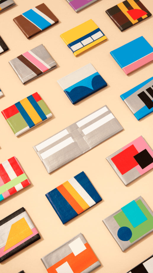 Colorful wallet designs on a beige background