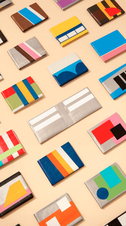 Colorful wallet designs on a beige background