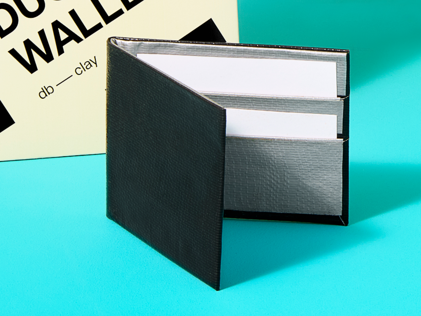 Black duct tape wallet on a blue background 