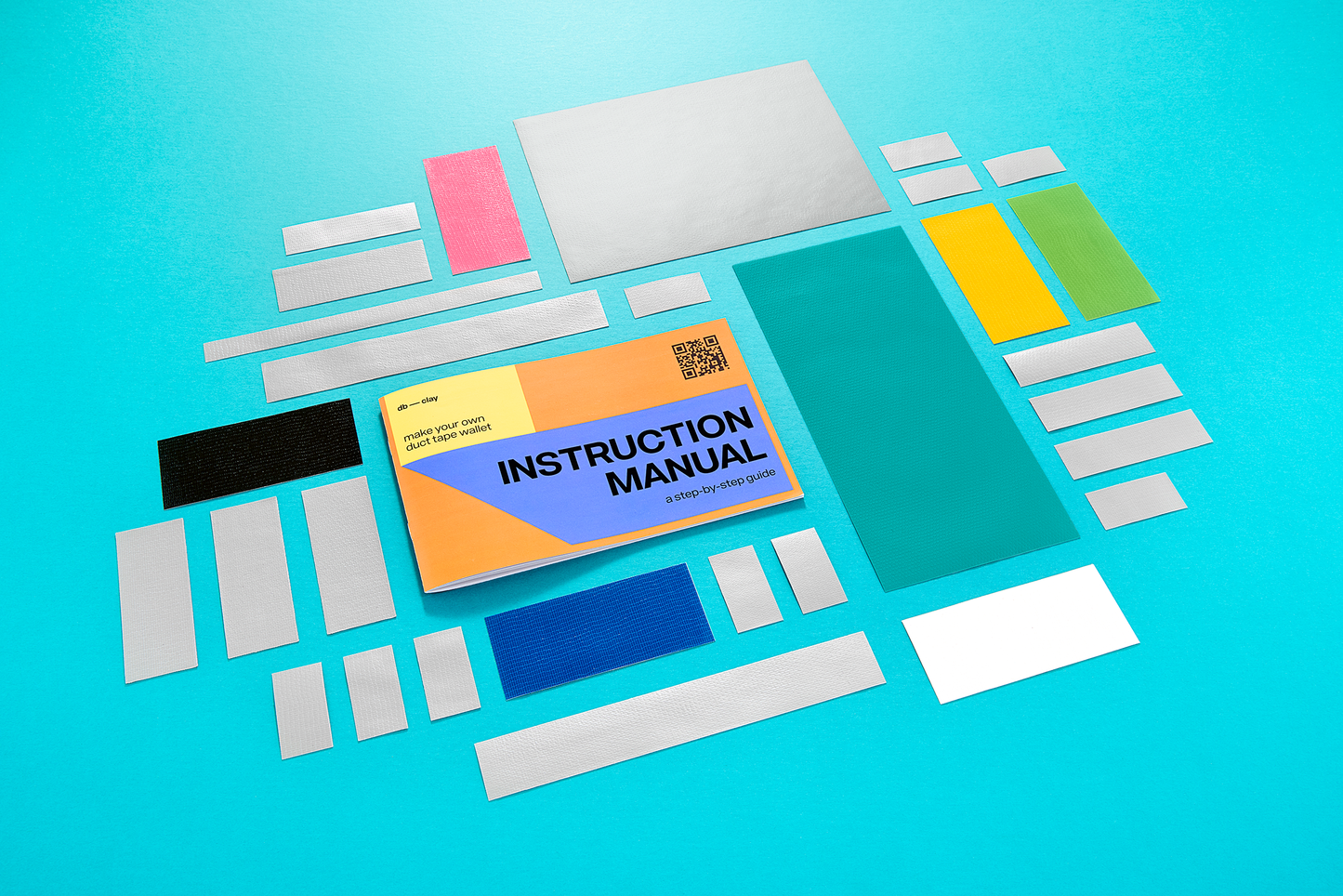 Instruction manual with colorful duct tape pieces on a blue background