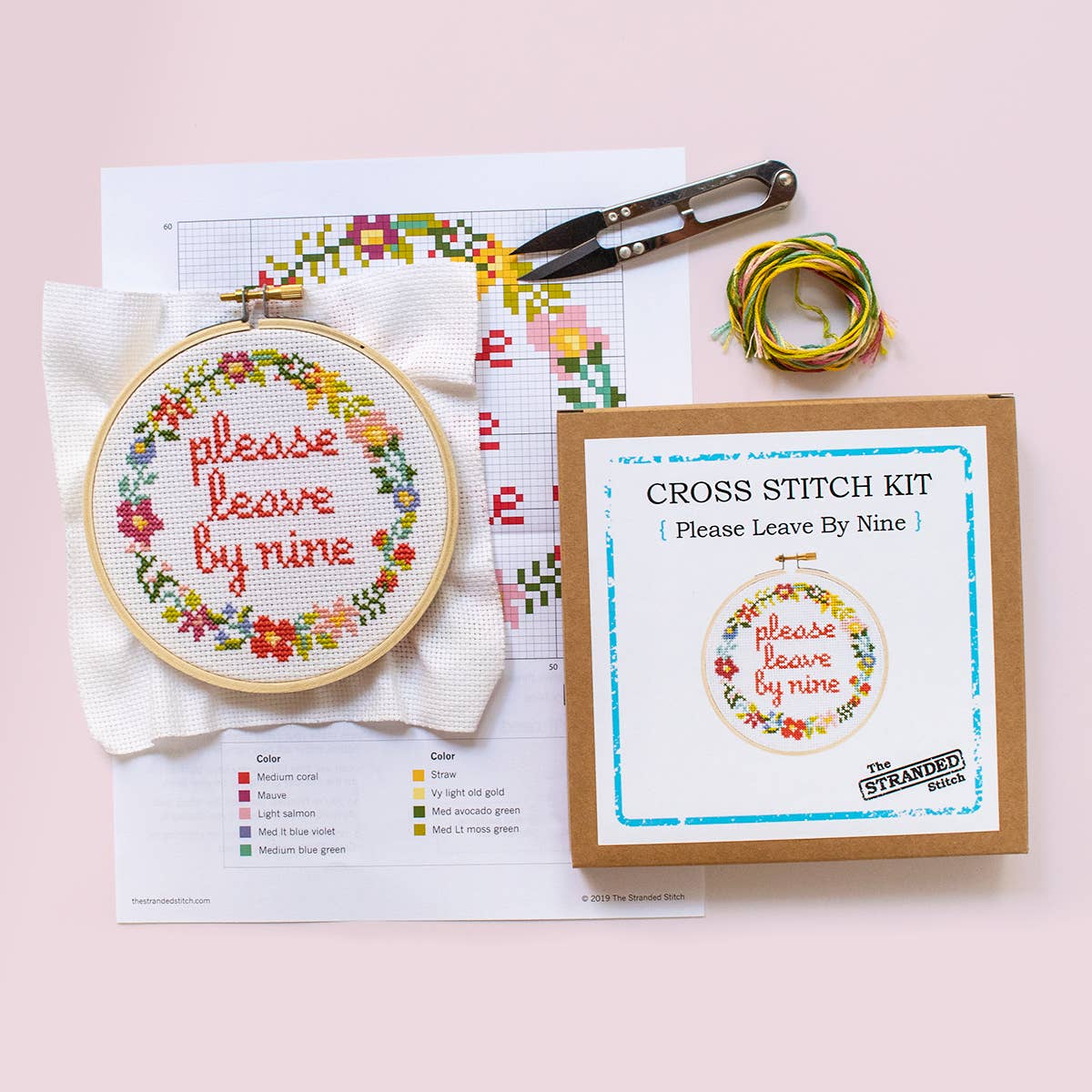 The kit displayed laid out on a pale pink background, along with a pair of thread snips (not included with kit).